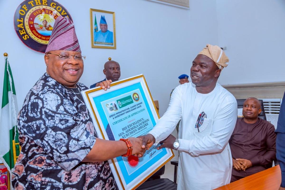 The Governor of Osun State receiving the Certificate of Appreciation from the Africa Infrastructure, Climate Change and Investment Green Summit, presented by the organising committee